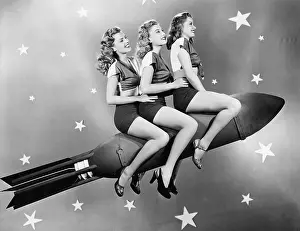 Conformity: Three women sitting on a rocket