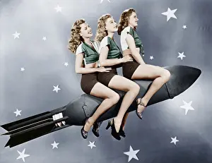 Conformity: Three women sitting on a rocket