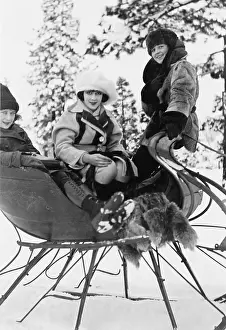 Pleasurable: Three women sitting in a sled