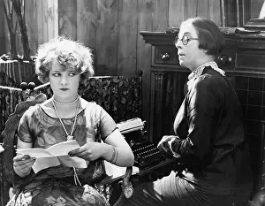 Saddened: Two women sitting together working