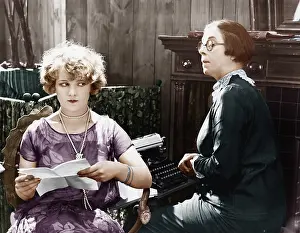 Saddened: Two women sitting together working