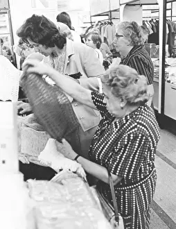 Vending: Women at a stand with clothes
