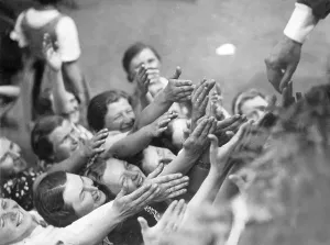 Seek: Women stretch their hands towards Adolf Hitler, 1938