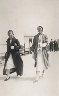 Breezy: Two women stroll along the seafront