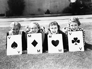 Conformity: Four women are well suited to lay on the grass with