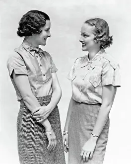 Two Women Talking Smiling Having Pleasant Conversation