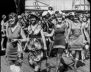Beachfront: Women Walking By In Bathing Suits on a Beachfront