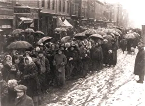Slush: Women walking through snow and slush to ?