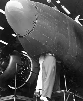 Lcgr1312: Two women workers standing through the bombardier's