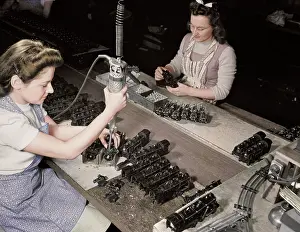 Responsibility: Women workers using an electric screwdriver
