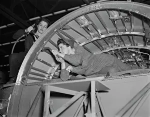 Confined: Women working on a center wing section of