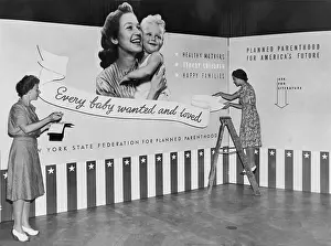 Contraception: Two women working on panels for exhibit ?