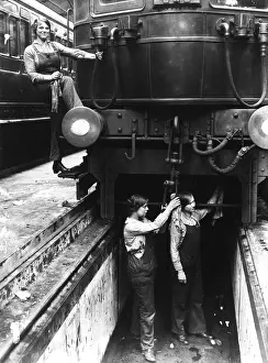 Wipe: Three women working on a train carriage