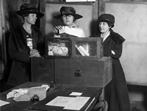 Ballots: Three women's suffragists casting votes ?