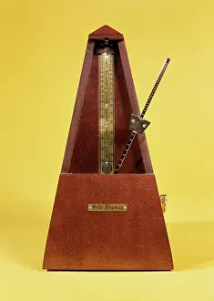 Tick: Wooden and brass metronome