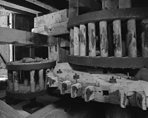 Tides: Wooden gears inside an old tide mill. The ?