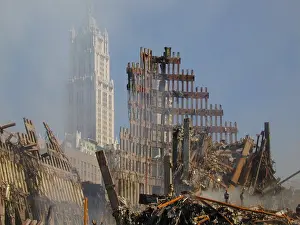 Fire Fighter: Woolworth Building rises behind the rubble of the