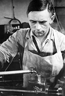 Does: Worker in an armaments factory, 40s