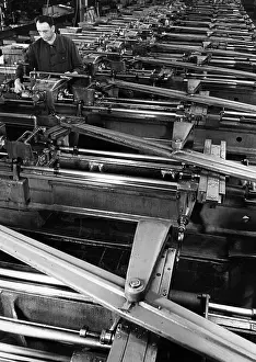 Operates: A worker in the armaments industry operates a machine park