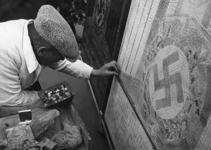 Handicrafts: Worker while laying a mosaic