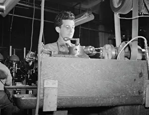 Bantam: Worker operating at a turret lathe at the