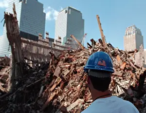 21st Century: Worker at the pile of rubble from the collapse