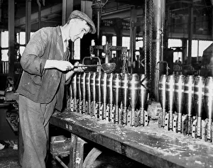 Prewar: Worker producing mortars in British munitions factory