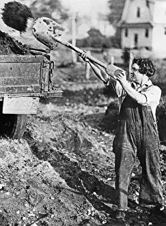 Shovels: Worker shovels earth