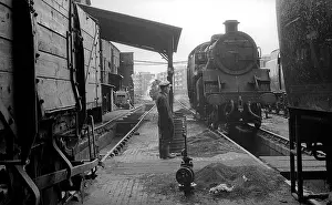 Pits: Worker standing between pits at Nine Elms Loco Yard
