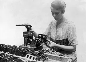 Stamping: Worker in a toy factory, 1925