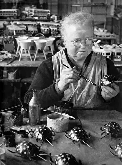 Paints: Worker in a toy factory in Nuremberg, 1933