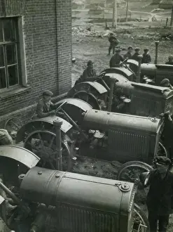 Modernization: Workers on American made McCormick Deering tractors