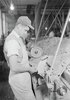 Holyoke: Workers buffing rubber doll bodies, 1936