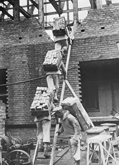 Ladders: Workers carry bricks, 1939