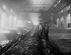Channels: Four workers casting pig iron in the Iroquois