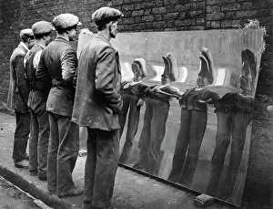 Distortion: Workers in a distortion mirror