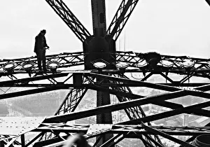 Illuminate: Workers on the Eiffel Tower, 1937