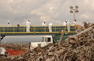 Forensics: Workers at the Fresh Kills Landfill examine ?
