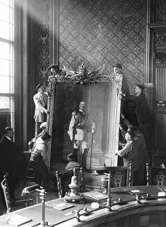 Minded: Workers hang the image of Wilhelm II, 1933