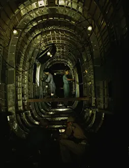 Worth: Workers installing structural parts of a C-87