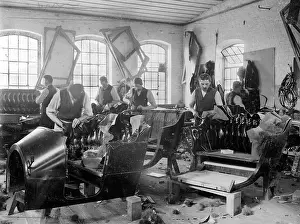 Upholstery: Workers making car seats in German upholstery workshop