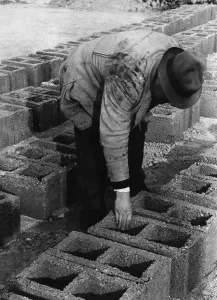 Checked: Workers in the production of bricks