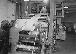 Reel: Workers putting on roll, starting operation