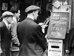 Chalked: Workers reading the first news of