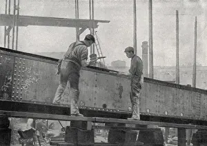 Girder: Workers riveting a girder at a Sunderland shipyard