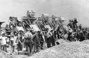 Provision: Workers shoveling gravel