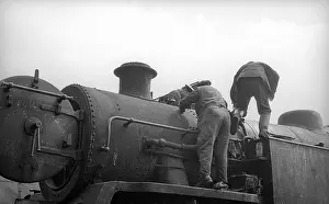 Bedford: Two workers on steam engine at Nine Elms Loco Yard