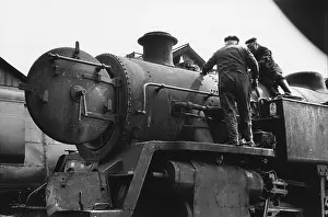 Bedford: Two workers on steam engine at Nine Elms Loco Yard