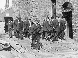 Breakers: Workers go to work during a strike in England, 1910