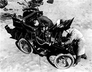 Garages: WORKING ON A MOTOR CAR